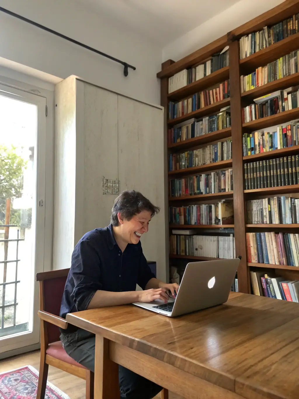 A student happily coding on a laptop, surrounded by books and learning materials, representing the beginner-level web development course.